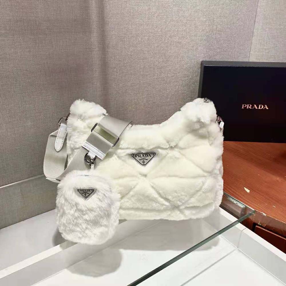 Side angle showing shearling texture and flap closure of Prada shoulder bag