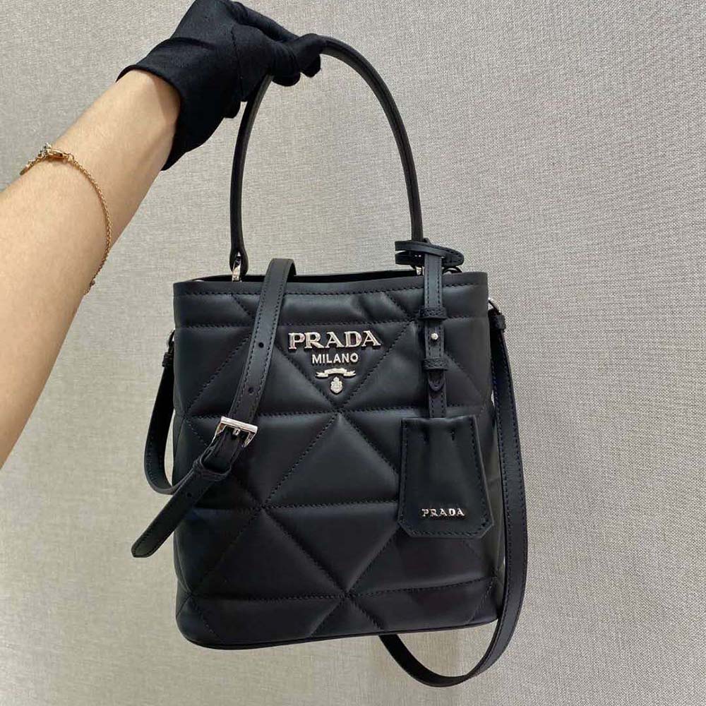 Close-up of silver-tone hardware on Prada Women Bucket Design Spectrum Leather Bag-Black