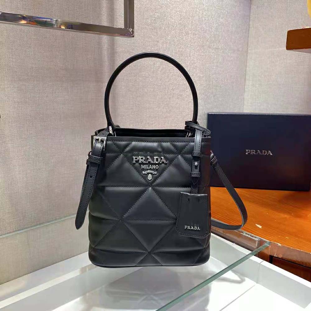 Side angle showing silhouette of Prada Women Bucket Design Spectrum Leather Bag-Black