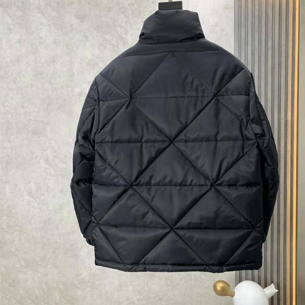 Side angle showing silhouette and sleeve detail of Prada Women Re-Nylon Down Jacket-Black