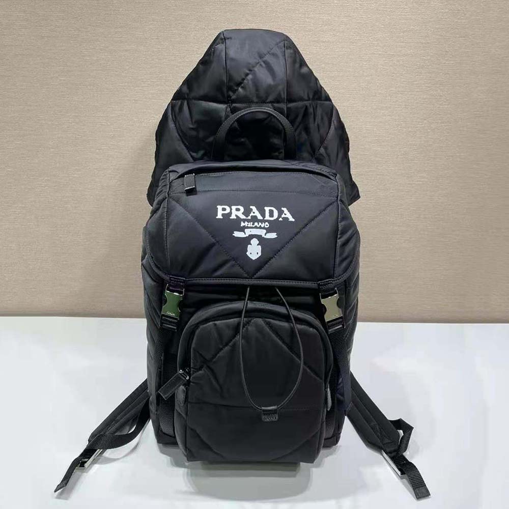 Side angle showing padded straps and sleek silhouette of Prada backpack
