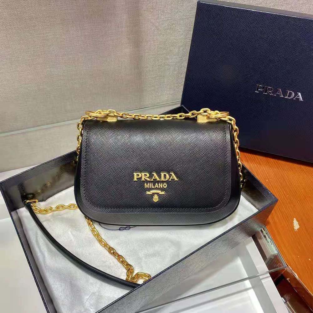 Side angle highlighting slim silhouette of Prada Women Saffiano Leather Shoulder Bag-Black