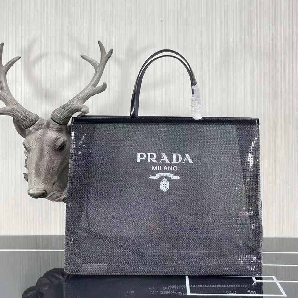 Close-up of sequined mesh fabric and silver hardware on Prada tote