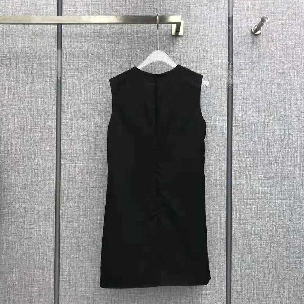 Side angle showcasing the sleeveless silhouette of Prada Re-Nylon mini-dress
