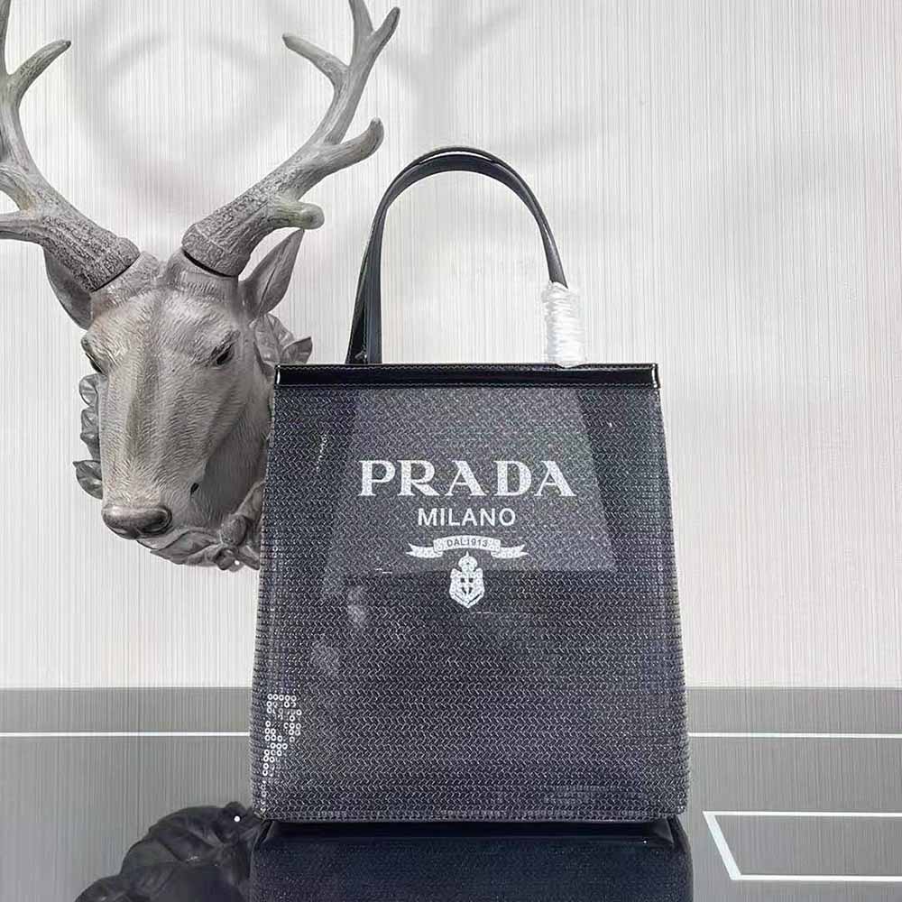 Close-up of silver-tone logo plaque on Prada Women Small Sequined Mesh Tote Bag-Black