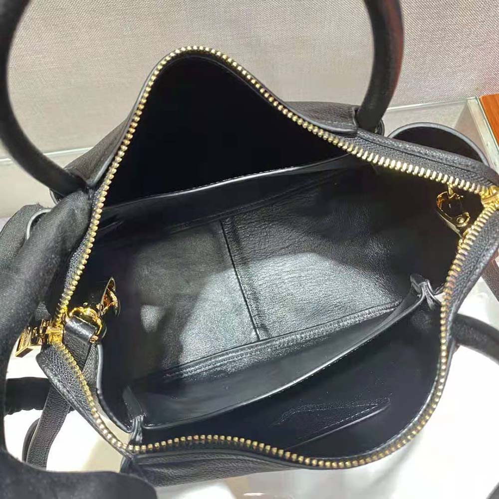 Prada Women Small leather Handbag with the Prada Metal Lettering Logo Illuminating Its Center - image 9