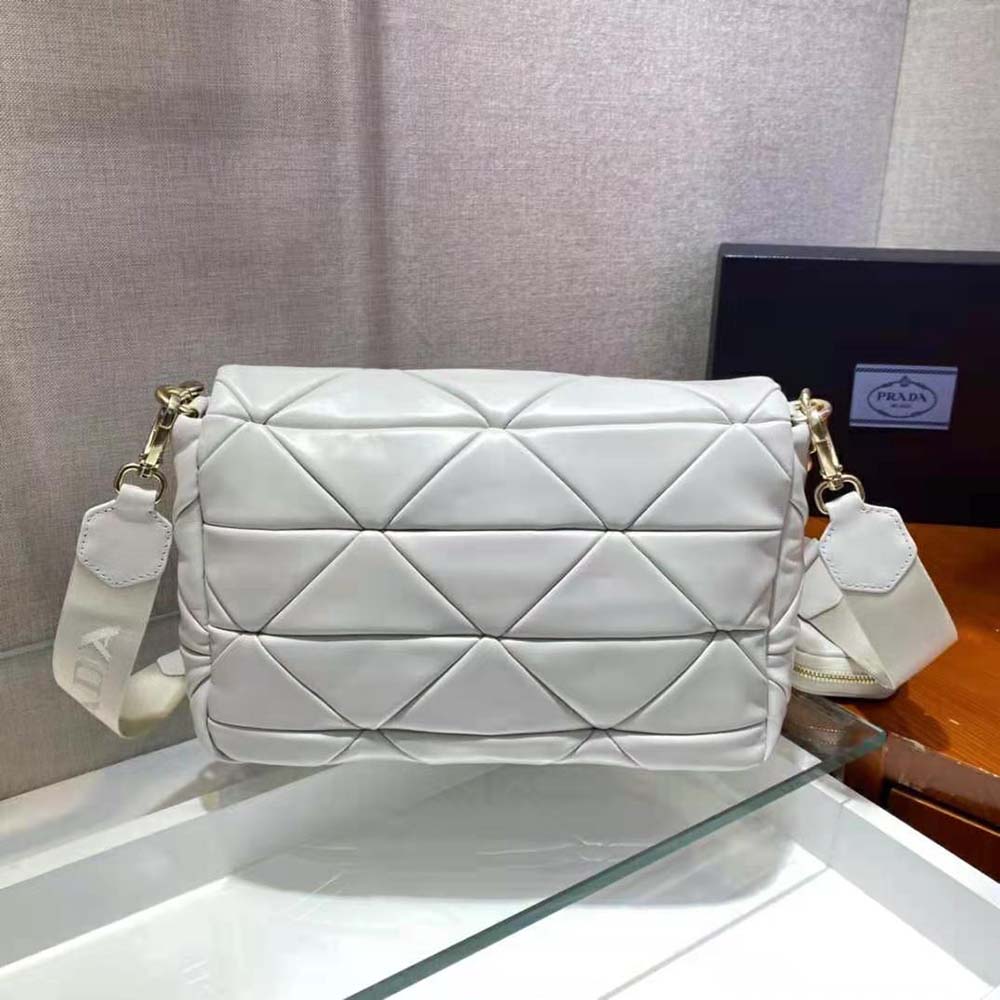 Side profile showing shoulder strap and shape of Prada Women System bag