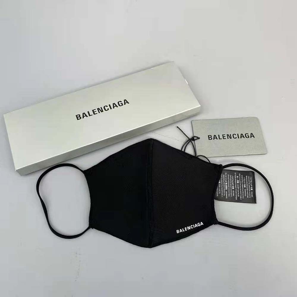 Close-up detail of Balenciaga printed logo on care mask