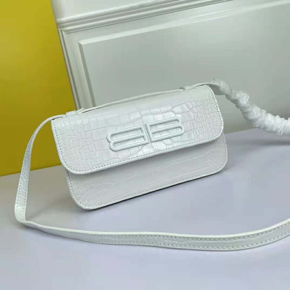 Side angle showing slim profile of Balenciaga Women Gossip Small Bag white