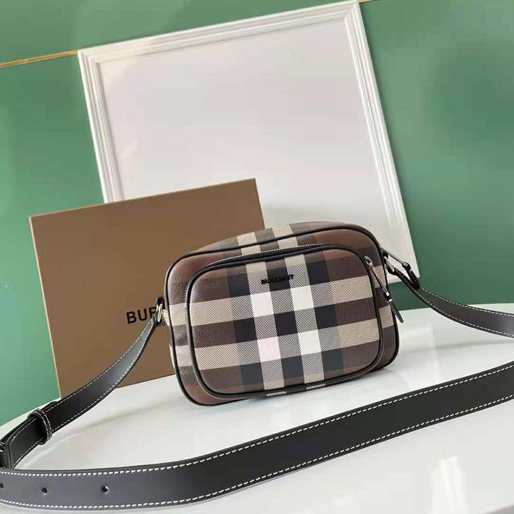 Close-up detail of Burberry check panel and leather texture