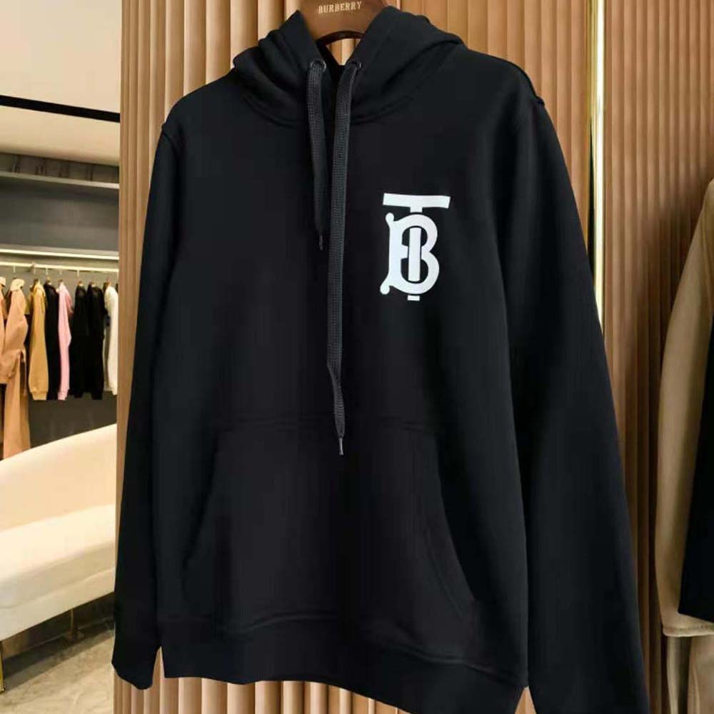 Close-up on Burberry monogram motif on black cotton hoodie