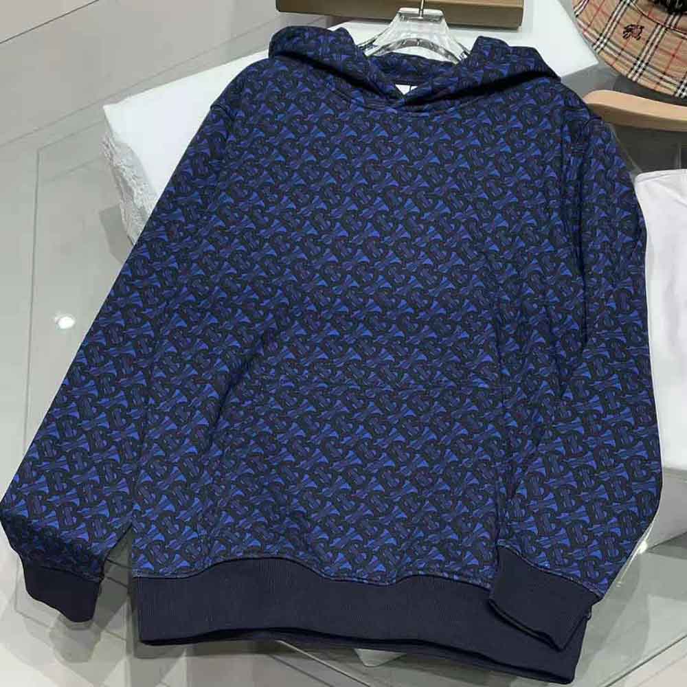 Close-up of Burberry monogram print on navy cotton hoodie