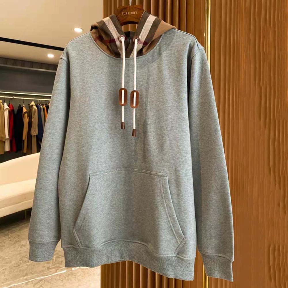 Close-up detail of Burberry check patch on silver cotton blend hoodie