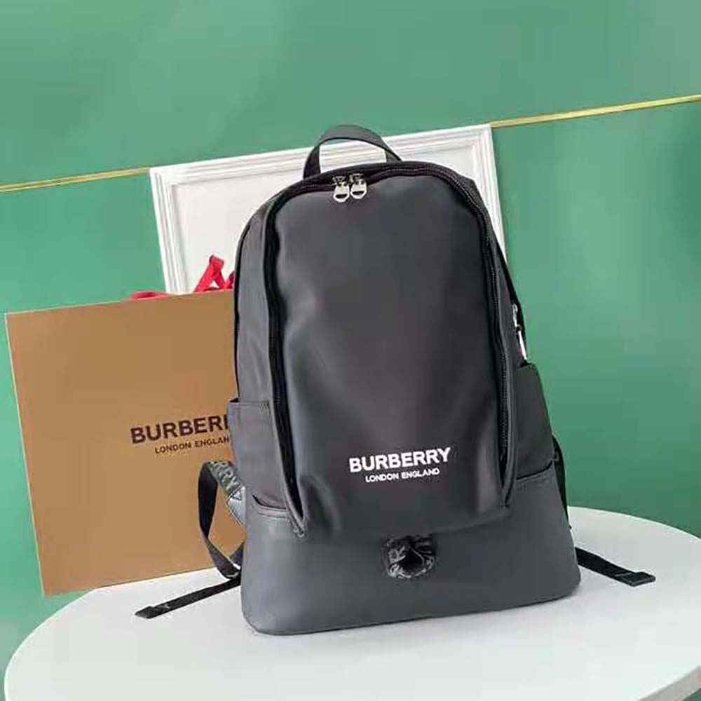 Close-up of Burberry logo print and leather detailing on backpack