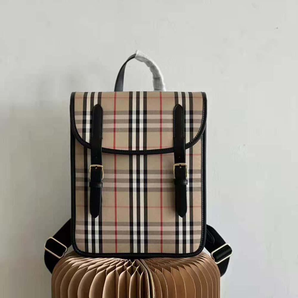 Close-up on gold-tone hardware and vintage check fabric detail