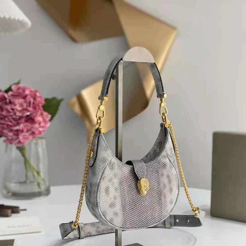 Side angle of Bvlgari Women Serpenti Ellipse Crossbody Bag-Silver highlighting adjustable strap