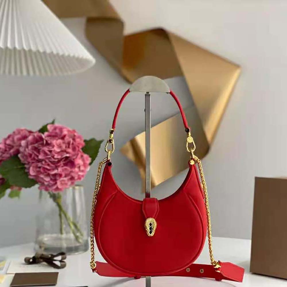 Close-up of gold serpent head clasp on Bvlgari Women Serpenti Ellipse Crossbody Bag