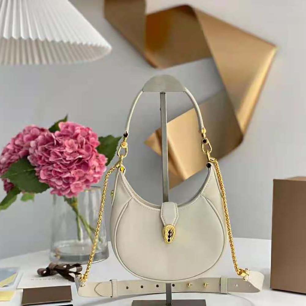 Close-up of signature serpent head clasp on Bvlgari Serpenti Ellipse Crossbody Bag