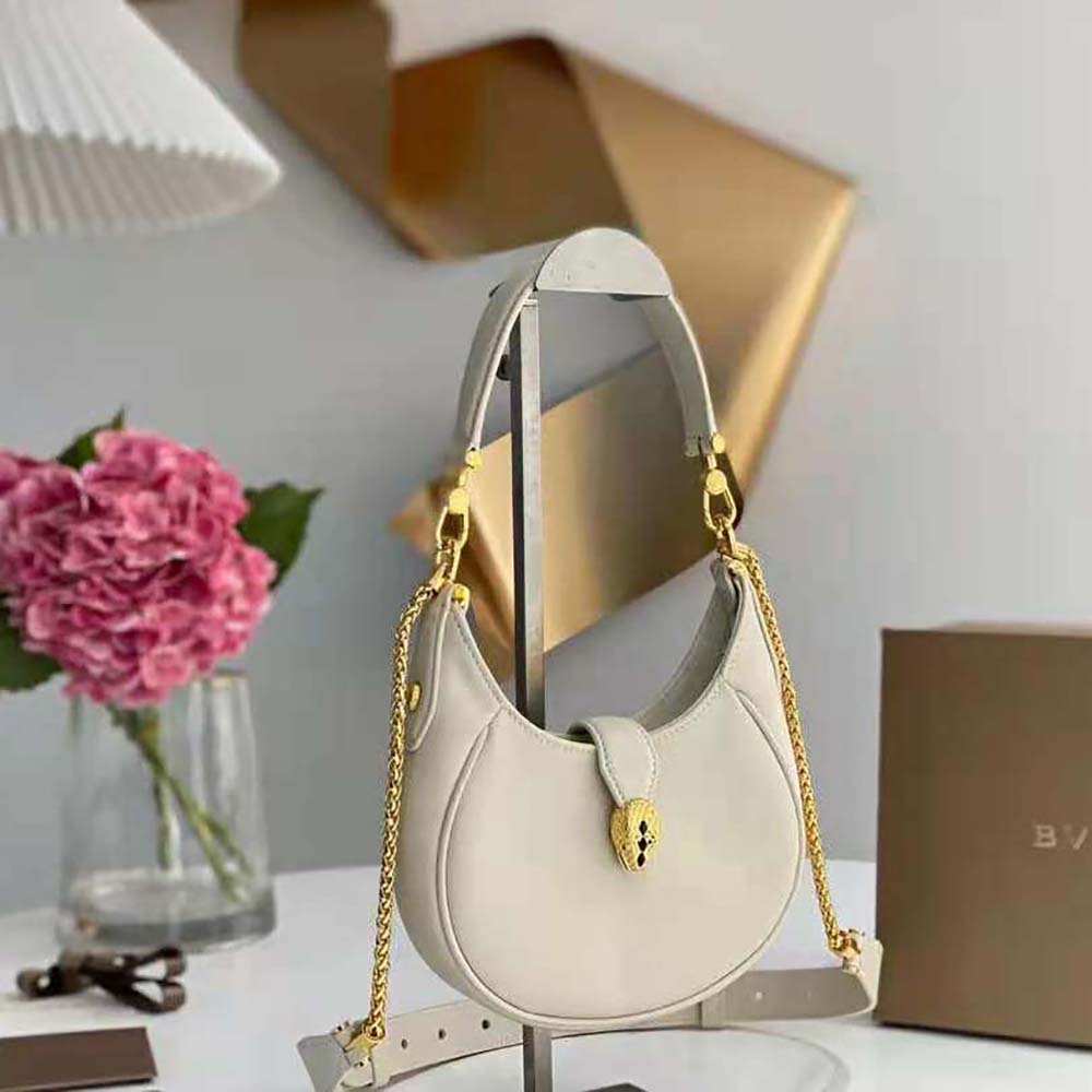 Side angle showing smooth leather and polished hardware of Bvlgari Serpenti Ellipse Bag