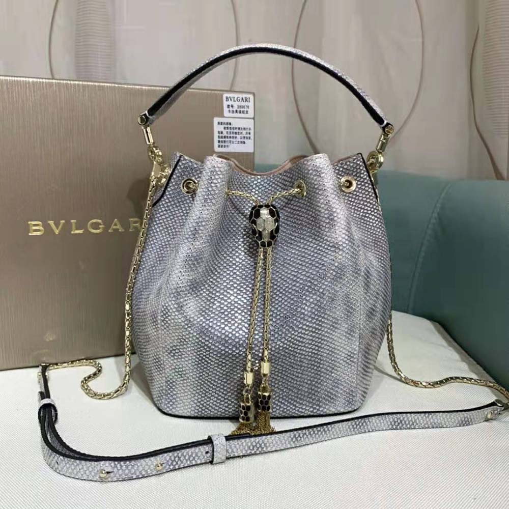 Close-up detail of silver snakehead closure on Bvlgari Women Serpenti Forever Bucket Bag