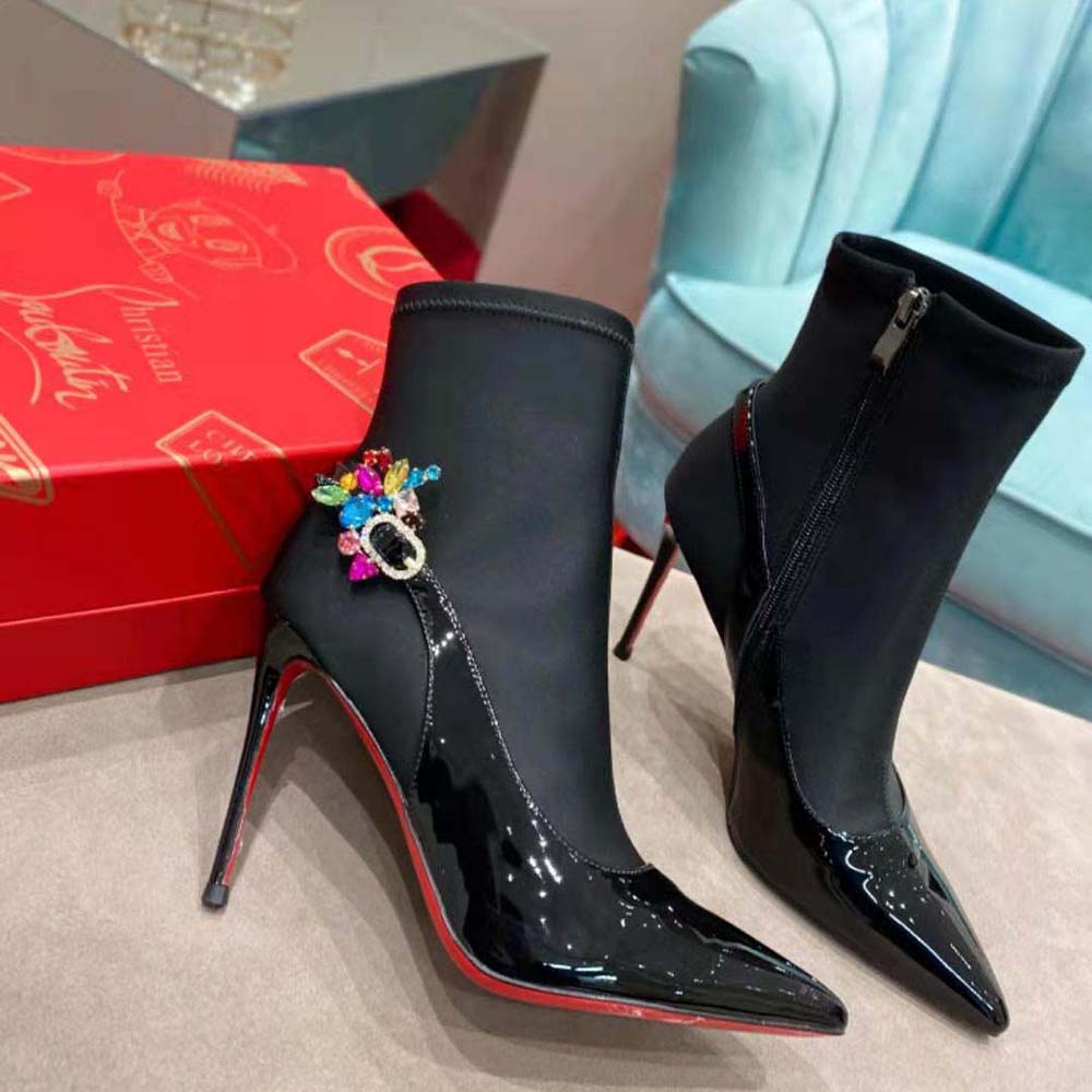 Front angle showcasing sleek silhouette of Christian Louboutin Jessie Booty Joli boot
