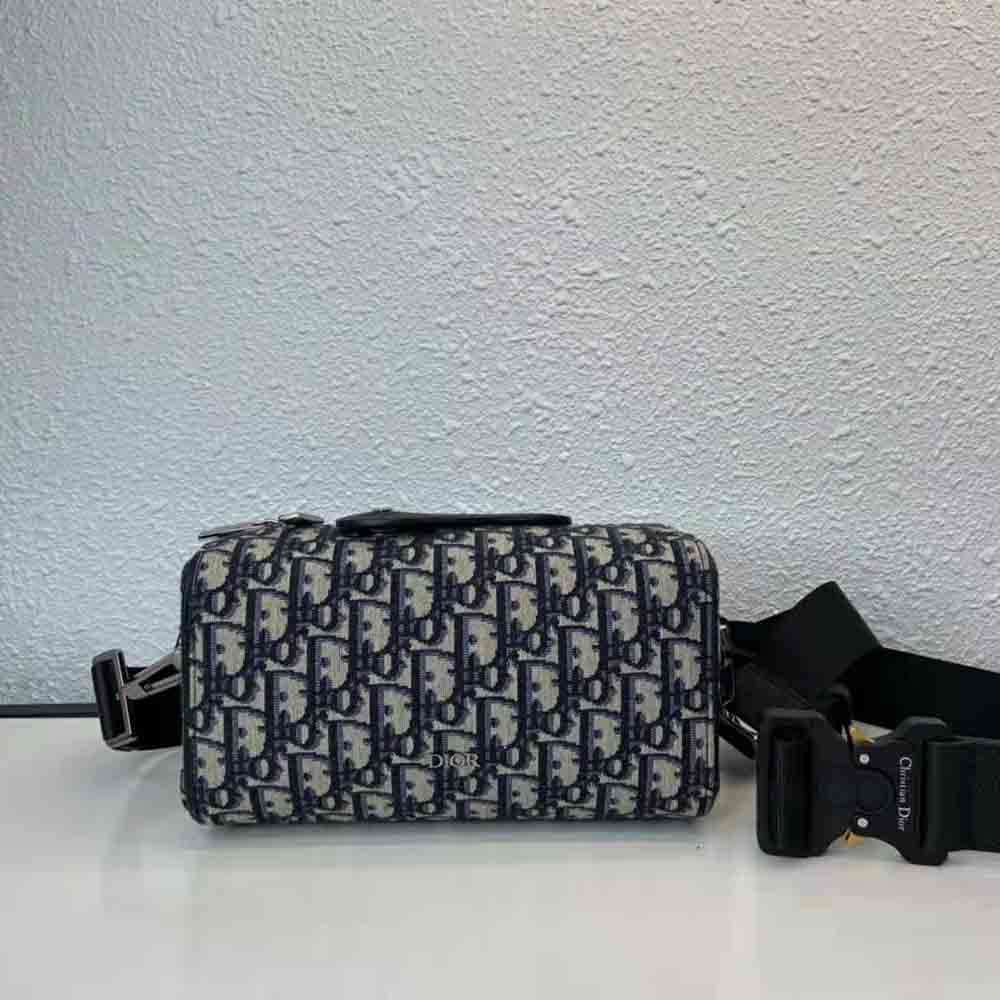 Close-up of silver hardware on Dior Men Lingot 22 Bag with blue accents