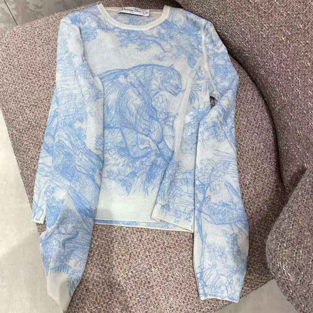 Side angle showing relaxed fit of Dior Women Chez Moi Embroidered Sweater