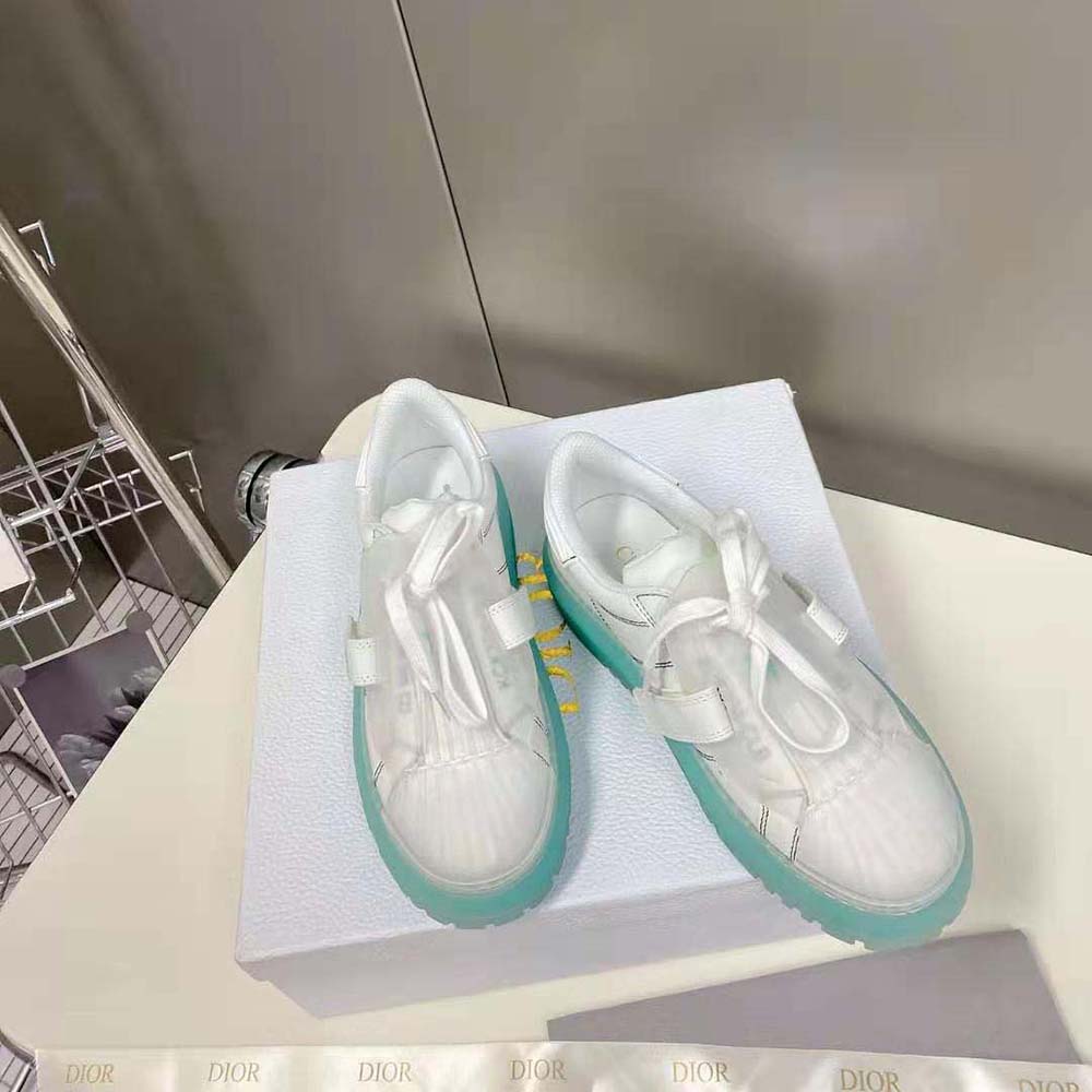 Top view showing white calfskin and Dior signature details on sneaker