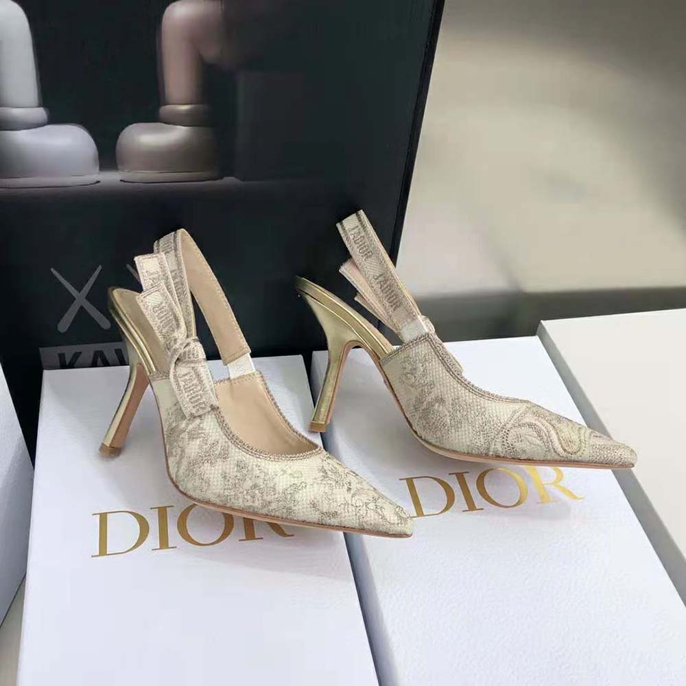 Close-up of gold-tone 'J'adior' hardware on Dior slingback pump