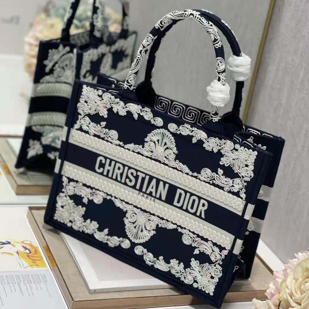 Side angle showcasing silver hardware on Dior Women Medium Dior Book Tote Blue