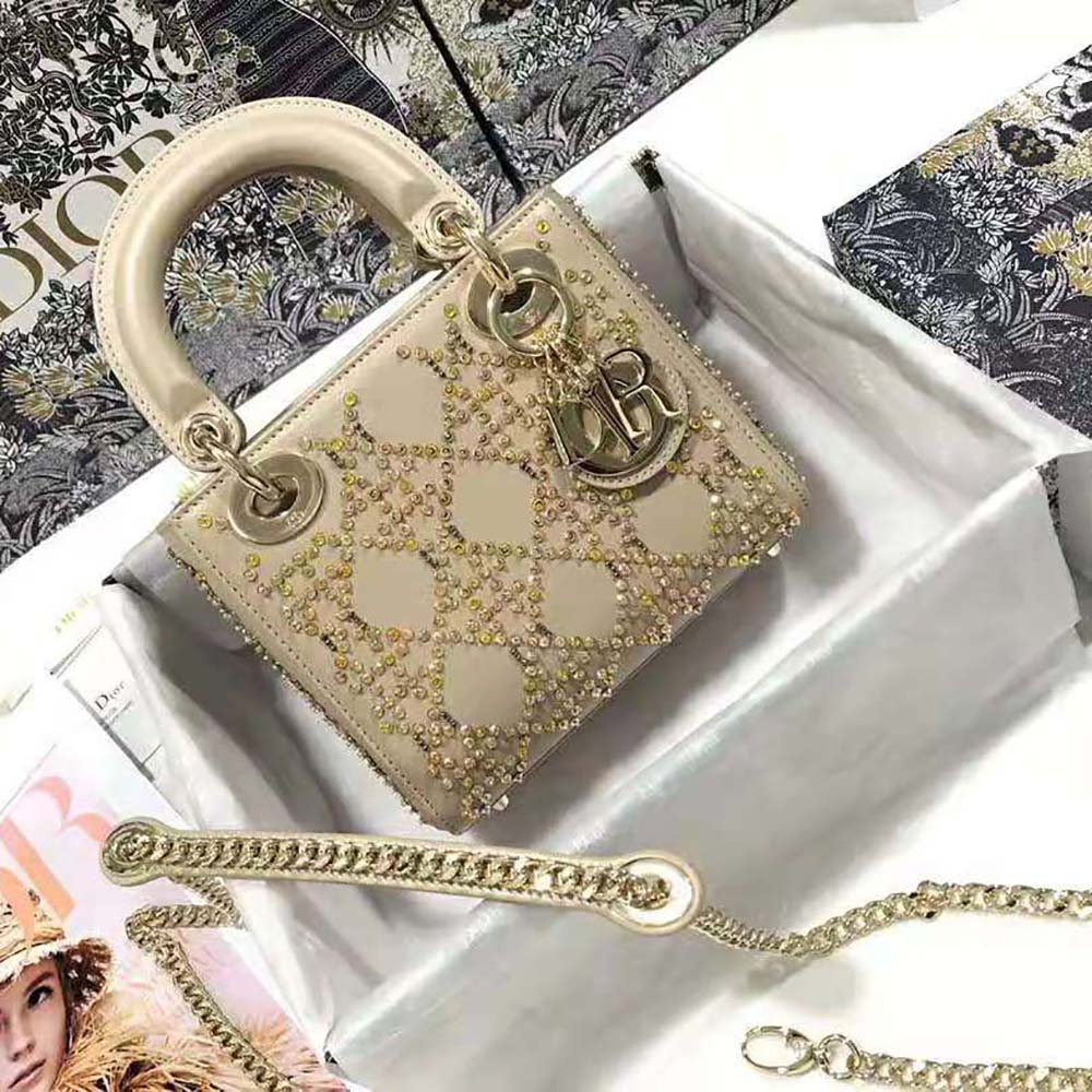 Close-up on platinum beaded embroidery and signature hardware on Dior Women Mini Lady Dior Bag