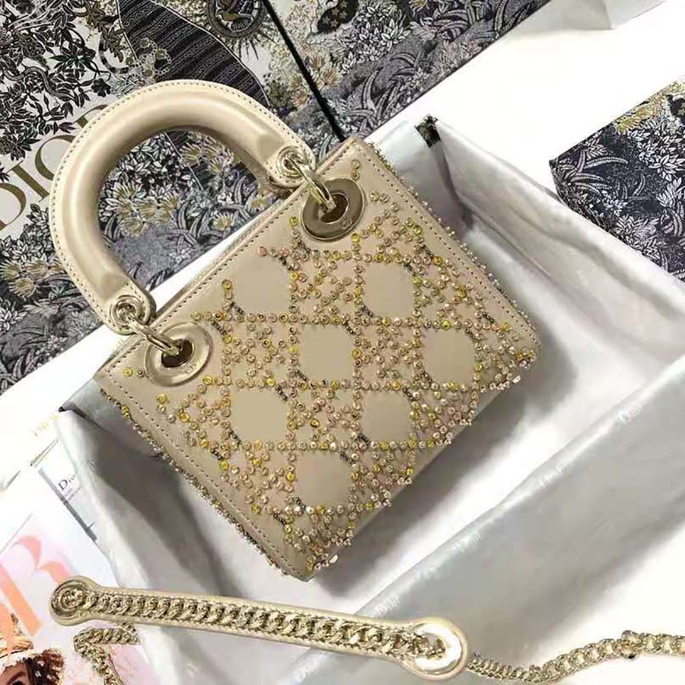 Side angle showing compact silhouette of Dior Women Mini Lady Dior Bag Metallic Cannage Calfskin