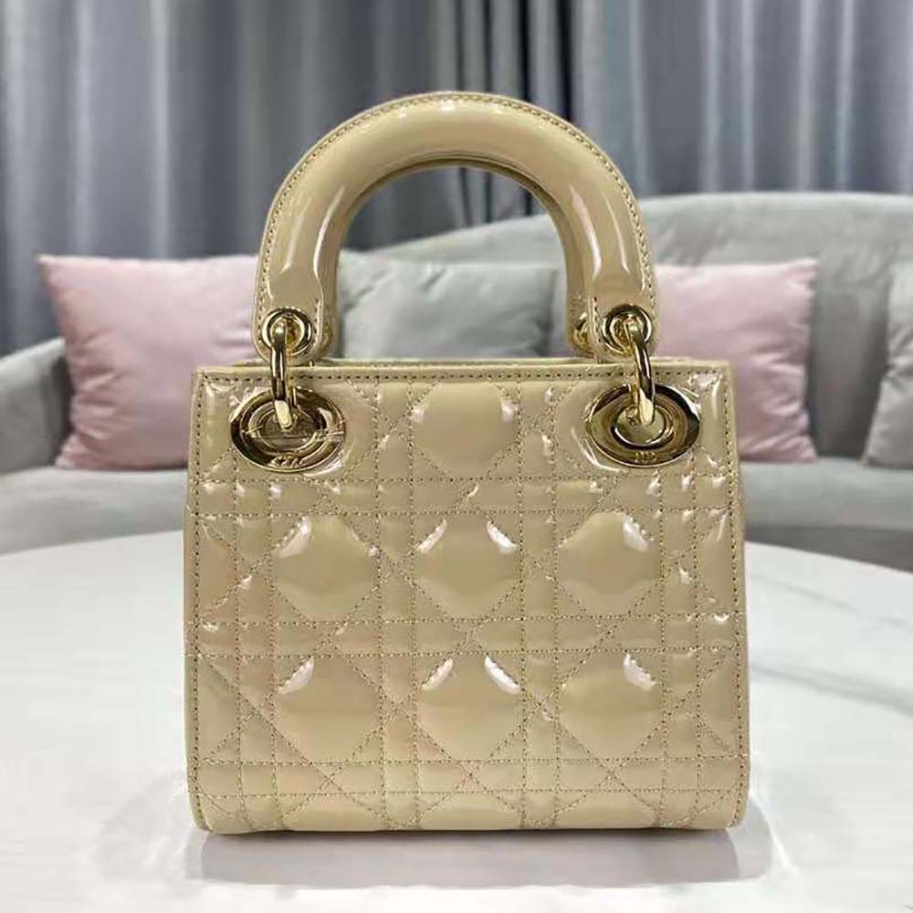Side angle showing glossy patent finish on Dior Women Mini Lady Dior Bag