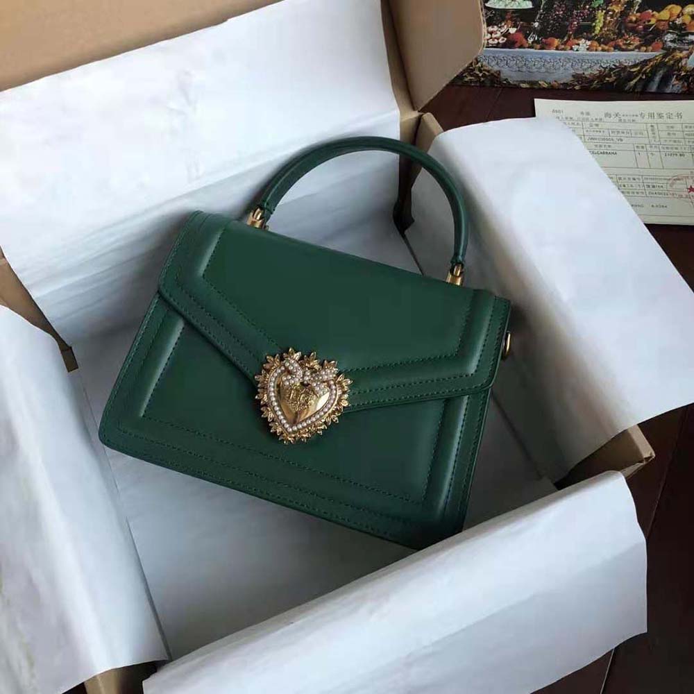 Close-up on gold-tone heart clasp of Dolce Gabbana Devotion Bag-Green