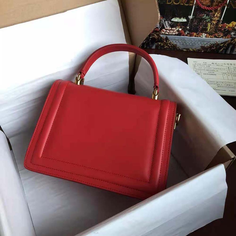 Side profile showing compact silhouette of Dolce Gabbana Devotion bag