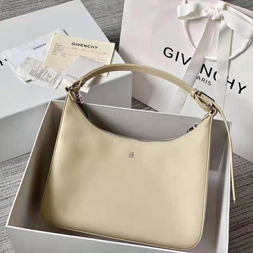 Side angle showing silver hardware on Givenchy Medium Moon Cut Out Bag