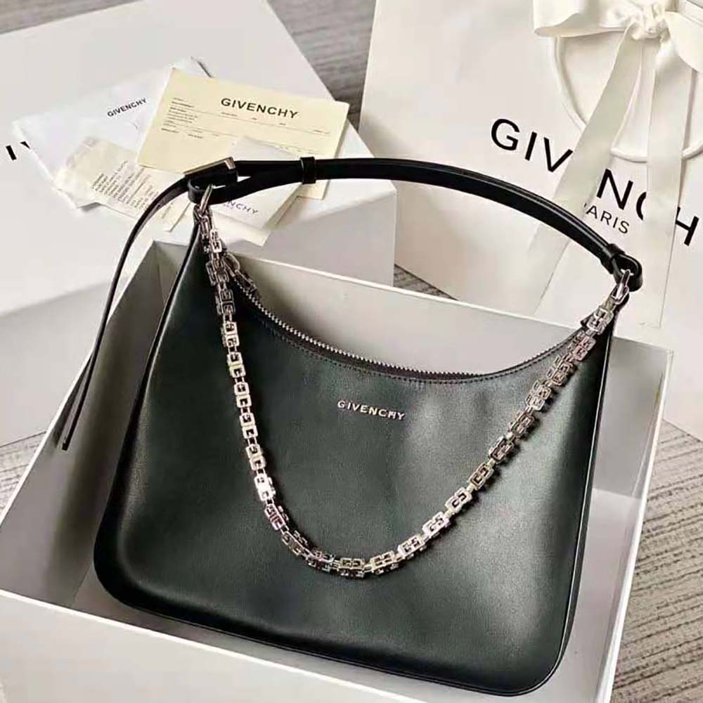 Close-up of moon-shaped cut out and silver hardware on Givenchy bag