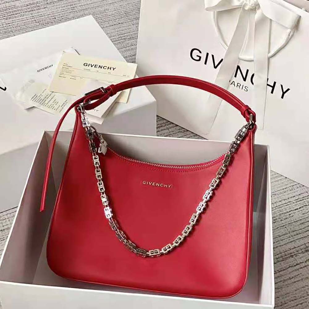 Close-up of moon-shaped cutout and gold-tone hardware on Givenchy bag