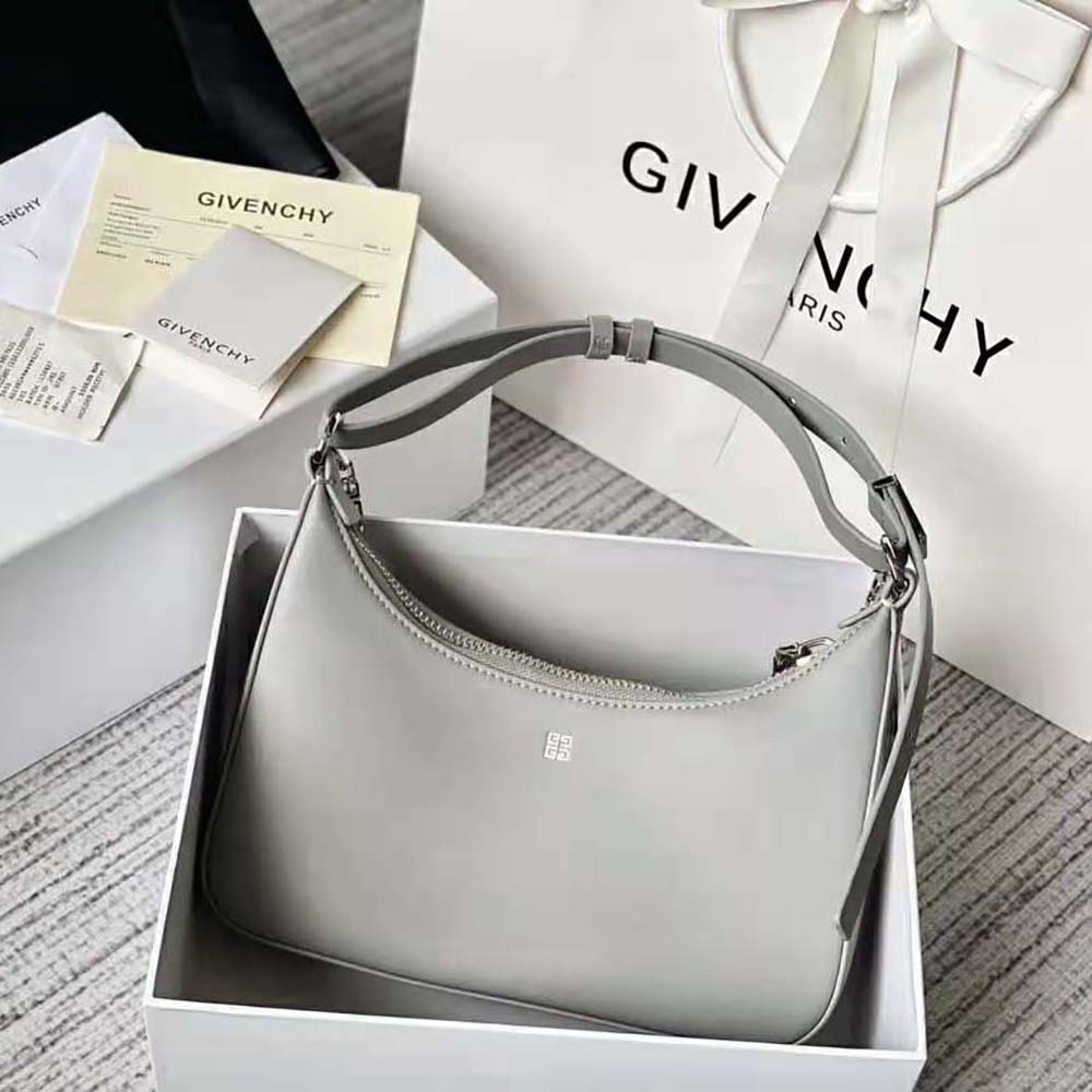 Side angle showing polished silver hardware on Givenchy Women Small Moon Cut Out Bag