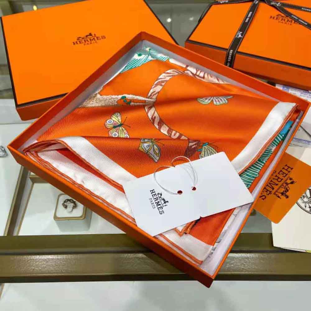 Close-up of hand-rolled edges on Hermes Women Story Scarf 90