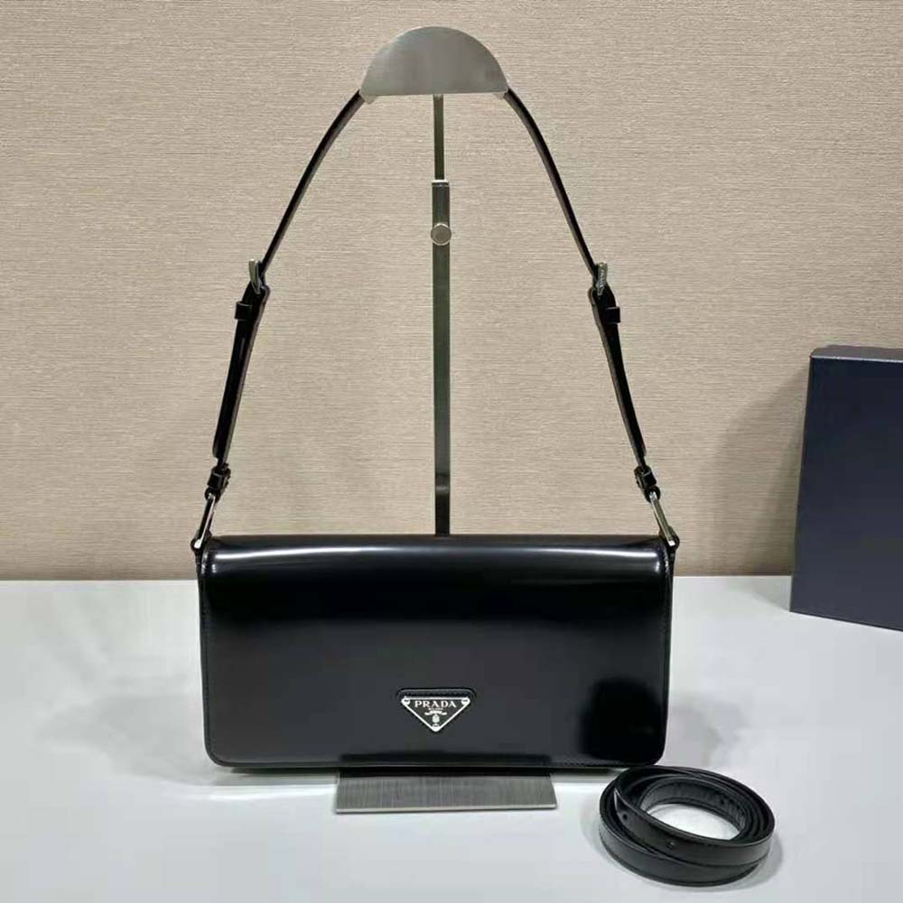 Close-up of silver Prada logo hardware on Prada Femme Bag-Black