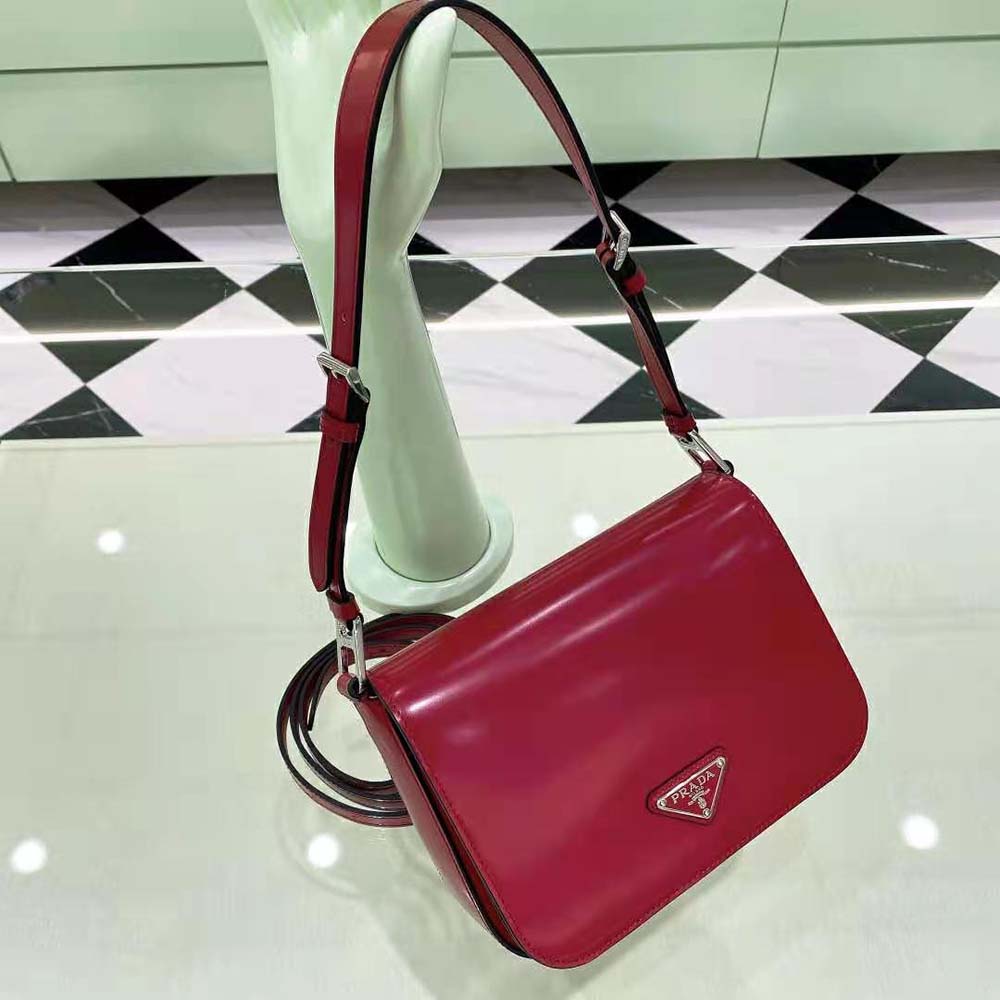 Close-up of brushed leather texture and silver hardware on Prada bag