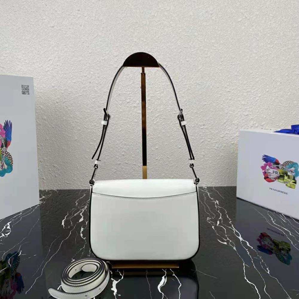 Side angle showing the adjustable strap on Prada Women Brushed Leather Shoulder Bag-White