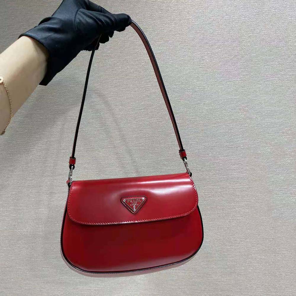Close-up of gold hardware on Prada Women Cleo Brushed Leather Shoulder Bag with Flap-Red