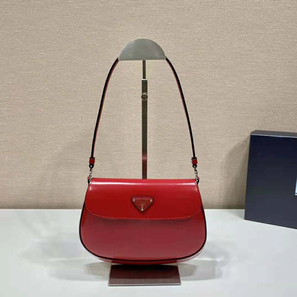Side angle showing red brushed leather texture on Prada Women Cleo Shoulder Bag