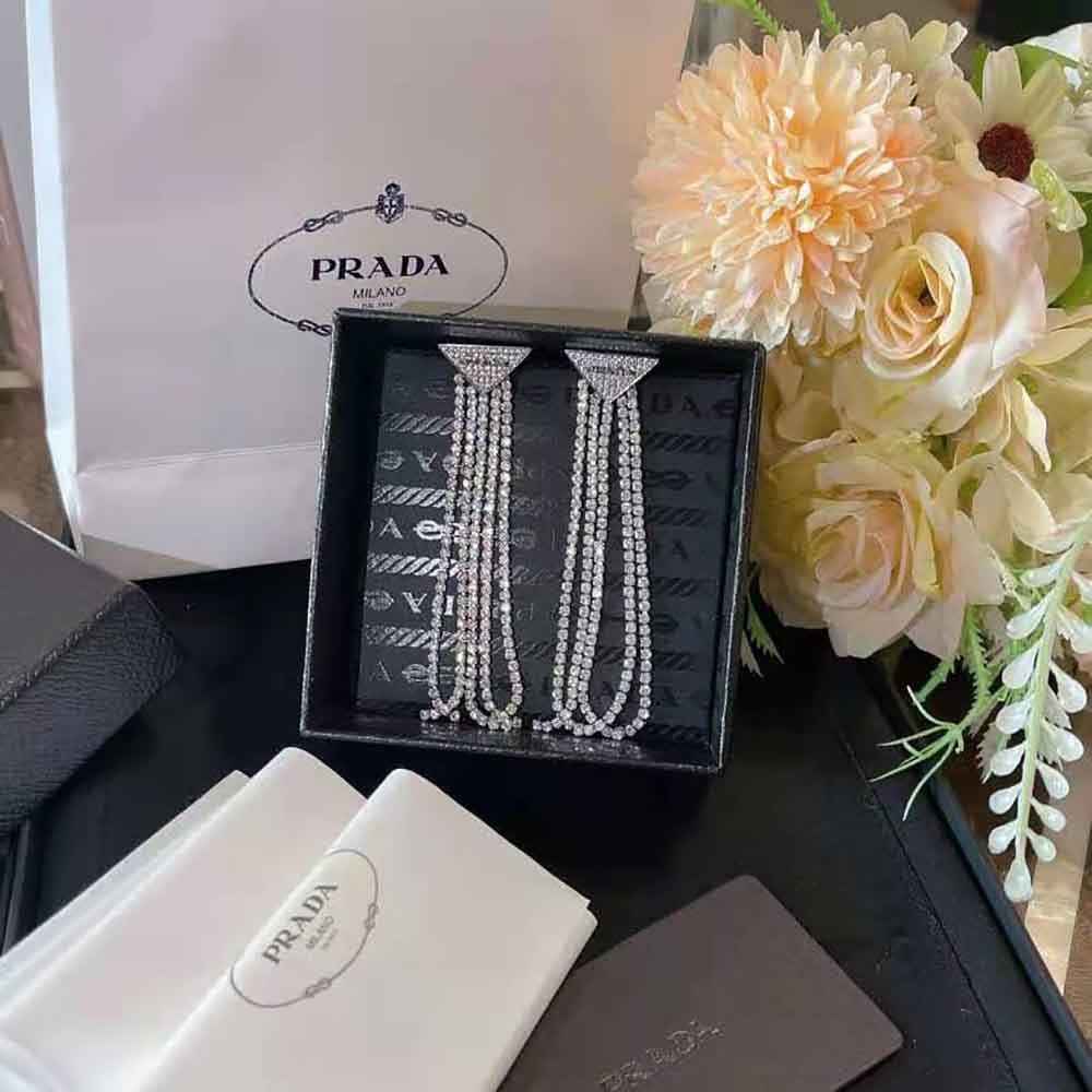 Close-up detail of signature zirconia stones on Prada Women Crystal Logo Jewels Earrings