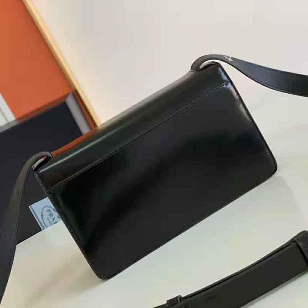 Side angle of Prada Women Embleme Brushed-Leather Bag-Black showing silhouette