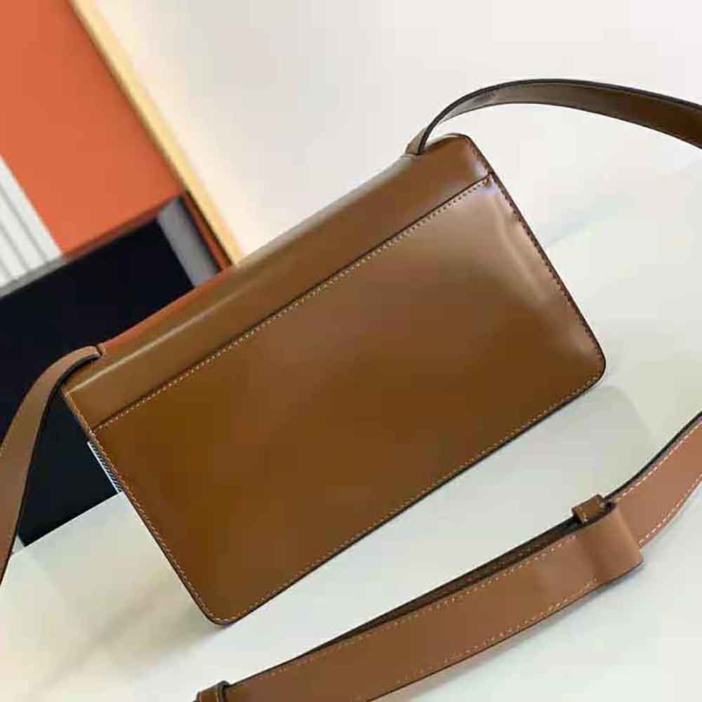Side angle showing silhouette of Prada Women Embleme Brushed-Leather Bag-Brown