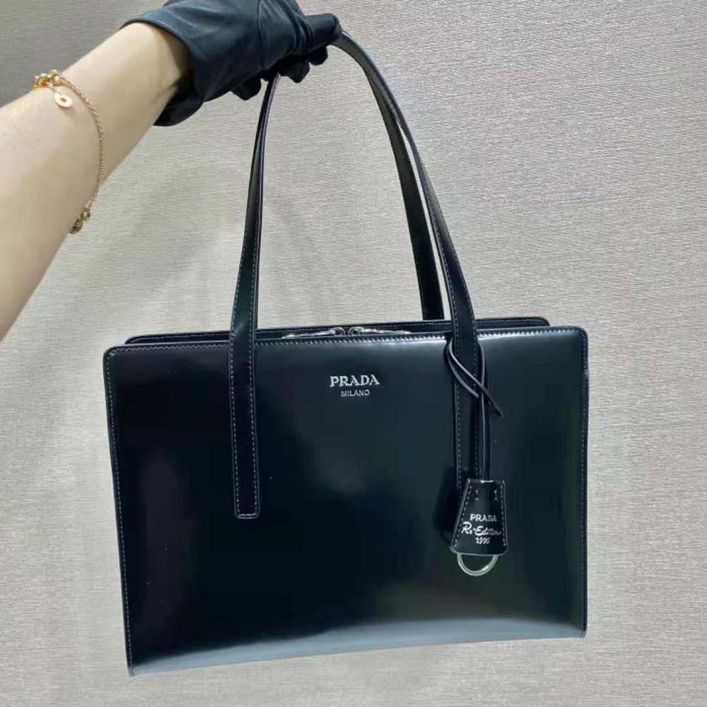 Close-up of brushed leather texture and silver hardware on Prada handbag