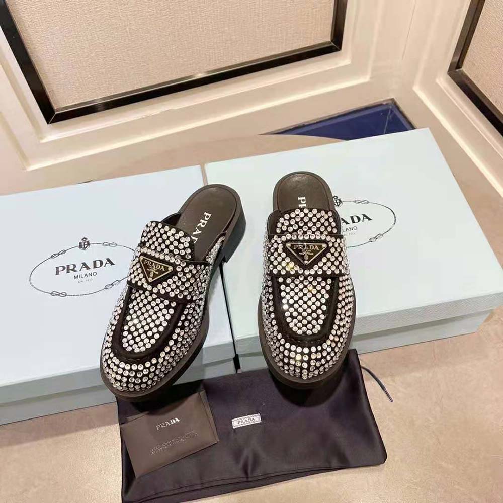 Close-up of crystal embellishments on Prada Women Satin Mules heel